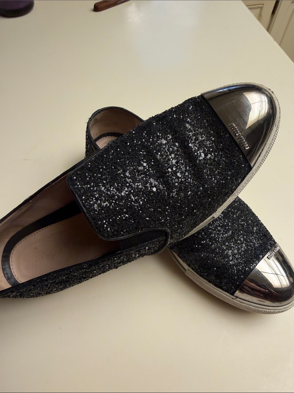 Miu Miu Black Glitter Slip-On Loafers with Silver Cap Toe 10/41